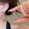 Open Oval Hoop Earrings with Crystal Accent in Silver Tone view 4