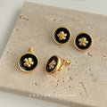 Black Enamel Gold Camellia Round Clip Stud Earrings view 3