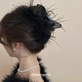 Black Feather Hair Claw With Sheer Fabric Loops And Loose Strands view 3