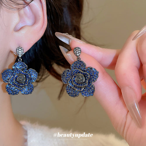 Deep Blue Crystal Layered Floral Statement Drop Earrings shown in worn view