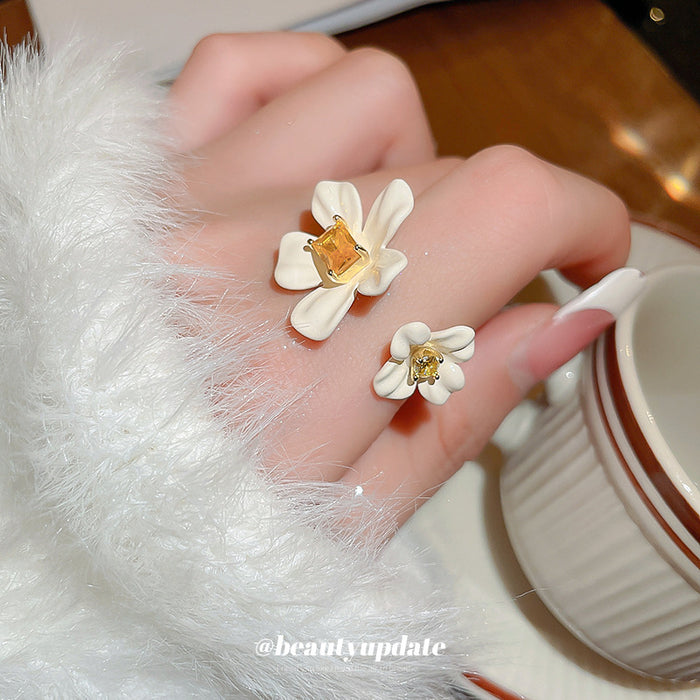 Gold Tone Open Ring With Two White Flowers And Yellow Square Crystal