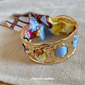 Gold Hammered Open Cuff Bracelet With Colorful Silk Scarf view 3