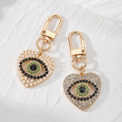 Main product view of gold Tone Rhinestone and Faux Pearl Heart Evil Eye Clip Keychains