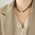 Black Glass Bead Necklace White Pearl Center Gold Accents view 1