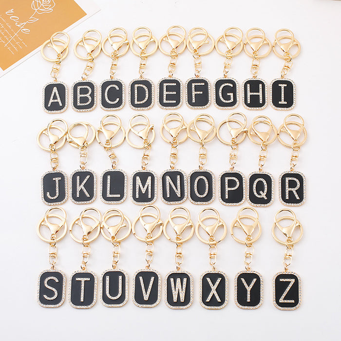 Rhinestone Initial Letter Keychain Black Enamel Gold Tone Tag