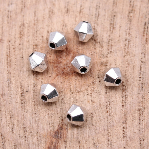 Front display of cube beads on a light background