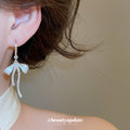 Silver Bow Hook Earrings in Polished Statement Design view 3