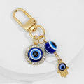 Gold Tone Evil Eye Charm Keychain With Hamsa Hand Accent view 3