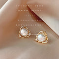 Gold Tone Crossed Circle White Pearl And Clear Stone Stud Earrings view 1