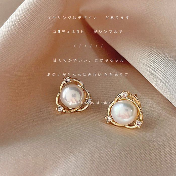 Gold Tone Crossed Circle White Pearl And Clear Stone Stud Earrings