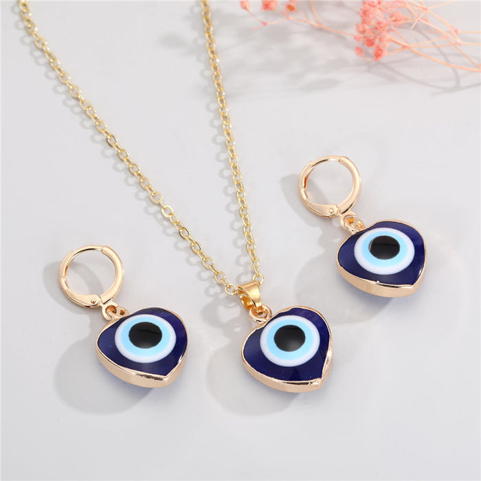 Gold Tone Heart-Shaped Blue Evil Eye Necklace and Huggie Earrings