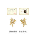 Gold Tone Clear Stone Osmanthus Flower Earrings In Clip And Stud Styles view 2