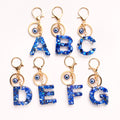 Blue Shell Resin Letter Keychain with Evil Eye Charm view 1