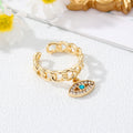 Gold Tone Curb Chain Crystal Evil Eye and Hamsa Charm Rings view 9