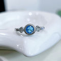 Blue Round Crystal Twist Band Ring in Silver Tone Polished Metal Jewelry view 3