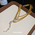 Gold Layered Pearl Drop Necklace with Graduated Chain Strands view 4