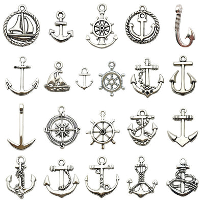 Metallic assorted shape charms arranged on a light background