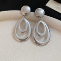 Layered Open Teardrop Earrings in Gold and Silver Tone view 7