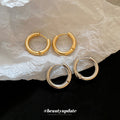 Polished Round Huggie Earrings in Silver Tone and Gold Tone view 3