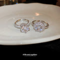 Two Silver Tone Solitaire Rings In Round Halo Or Oval Crossover Styles view 2