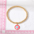 Gold Tone Bead Stretch Bracelets with Round Evil Eye Charms view 5