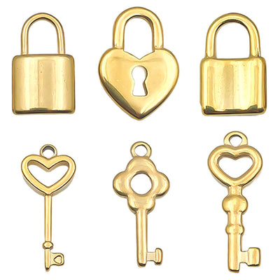 Gold-tone heart charms arranged on a light background