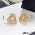 Interlocking Triangular Knot Stud Earrings In Two Metal Tones view 5