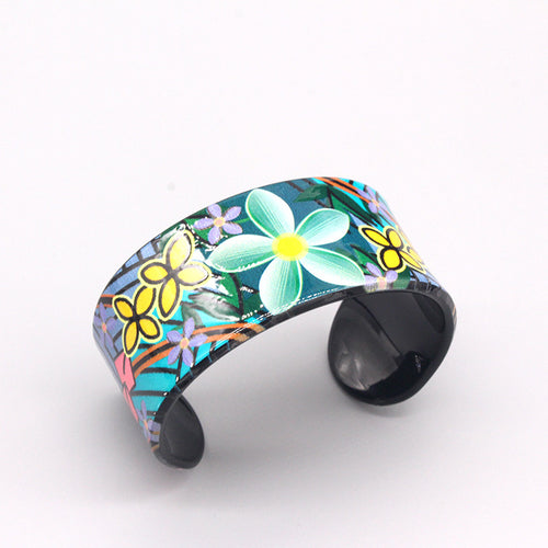 Close-up showing the colors and surface details of wide Floral Print Acrylic Open Cuff Bracelets in Three Colors