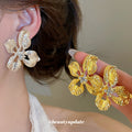 Open Hammered Flower Stud Earrings in Gold and Silver Tone view 2