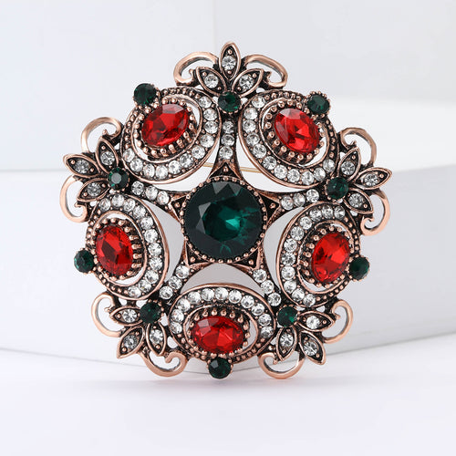 Copper tone red green crystal baroque floral brooch front view