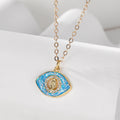 Gold Tone Blue Opal Effect Evil Eye and Hamsa Pendant Necklaces view 6