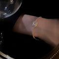 Gold Tone Tennis Bracelet With Square Clear Crystal Halo Center view 2