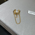 Gold Tone Double Ring Ear Cuff With A Fine Chain Drape view 1