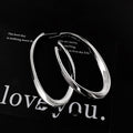 Polished Elongated Oval Hoop Earrings in Gold and Silver view 4