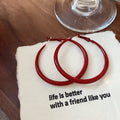 Red Textured Wavy Hoop Earrings in Two Sizes with Detailed Finish view 6