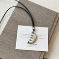 Silver Tone Necklace Trio With Sculptural Pendants view 8