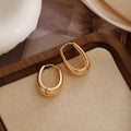 Gold Tone Chunky Rounded Square Huggie Hoop Earrings view 1