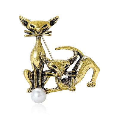 Antique gold twin cats brooch white pearl accent front on white background