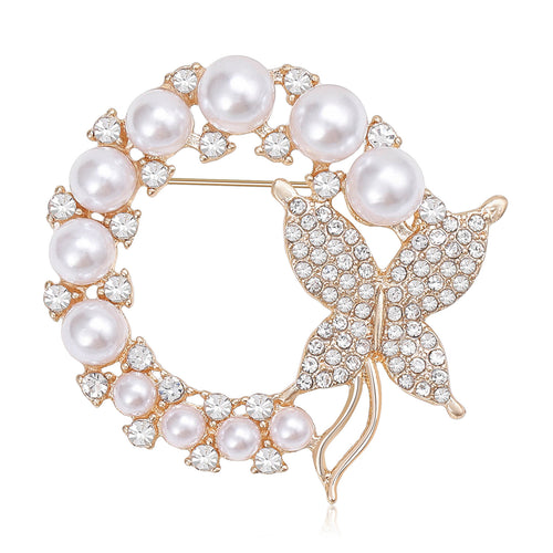 Gold pearl wreath butterfly brooch on white background
