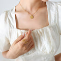 Embossed Rose Square Pendant Necklace Gold Or Steel Tone view 1