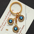 Triple Round Rhinestone Blue Evil Eye Keychains in Two Finishes view 4