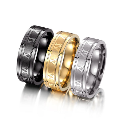 Black gold and steel Roman numeral band rings grouped together