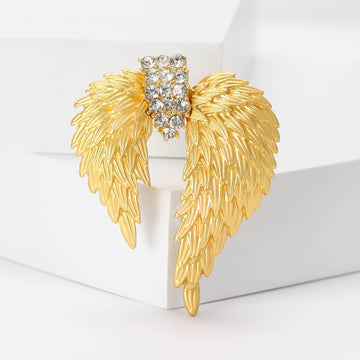 Gold Tone Layered Angel Wing Brooch With Crystal Center