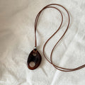 Oval Cutout Resin Pendant Long Cord Necklace in Two Colors view 4