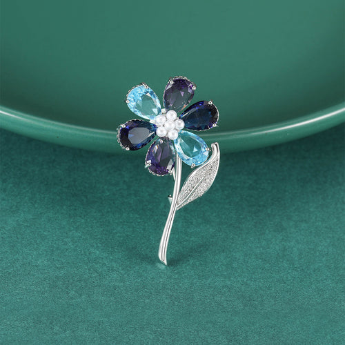 Faceted Petal Flower Brooch with Curved Crystal Stem front view on a white background