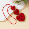 Beaded Red Heart Trio Pendant with Gold-Tone Trim and Red Cord view 3