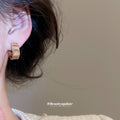 Light Gold Square Crystal Huggie Earrings with Ridged Frames view 3