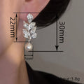 Silver Tone Crystal Leaf Earrings with Pearl Drop Accents view 4