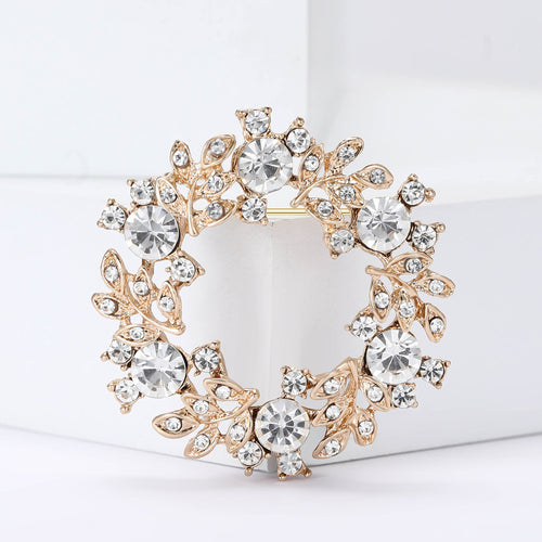 Gold tone crystal leaf wreath brooch front close-up