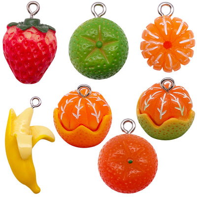 Multicolor strawberry charms arranged on a light background